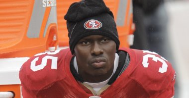 San Francisco 49ers cornerback Phillip Adams sits on the sideline during an NFL game in San Francisco, U.S., Oct. 17, 2010. (AP Photo)