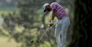 Dustin Johnson hits on the first fairway during the first round of the Masters golf tournament, Augusta, Ga., U.S., April 8, 2021. (AP Photo)