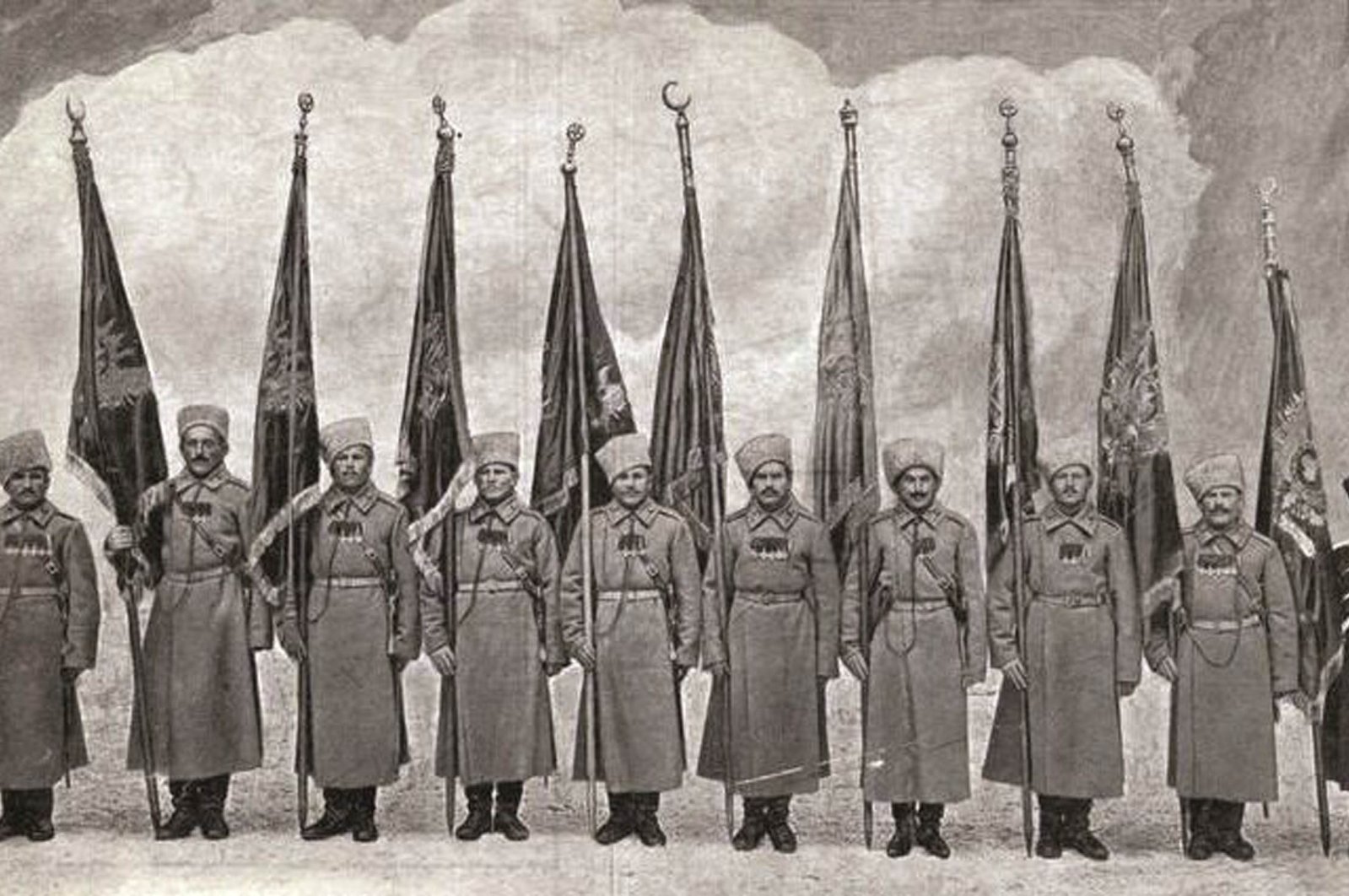 An old photo from historian Ümit Topal's archive showing Russian officers posing with standards seized in Erzurum, eastern Turkey, Feb. 16, 1916. (DHA PHOTO) 