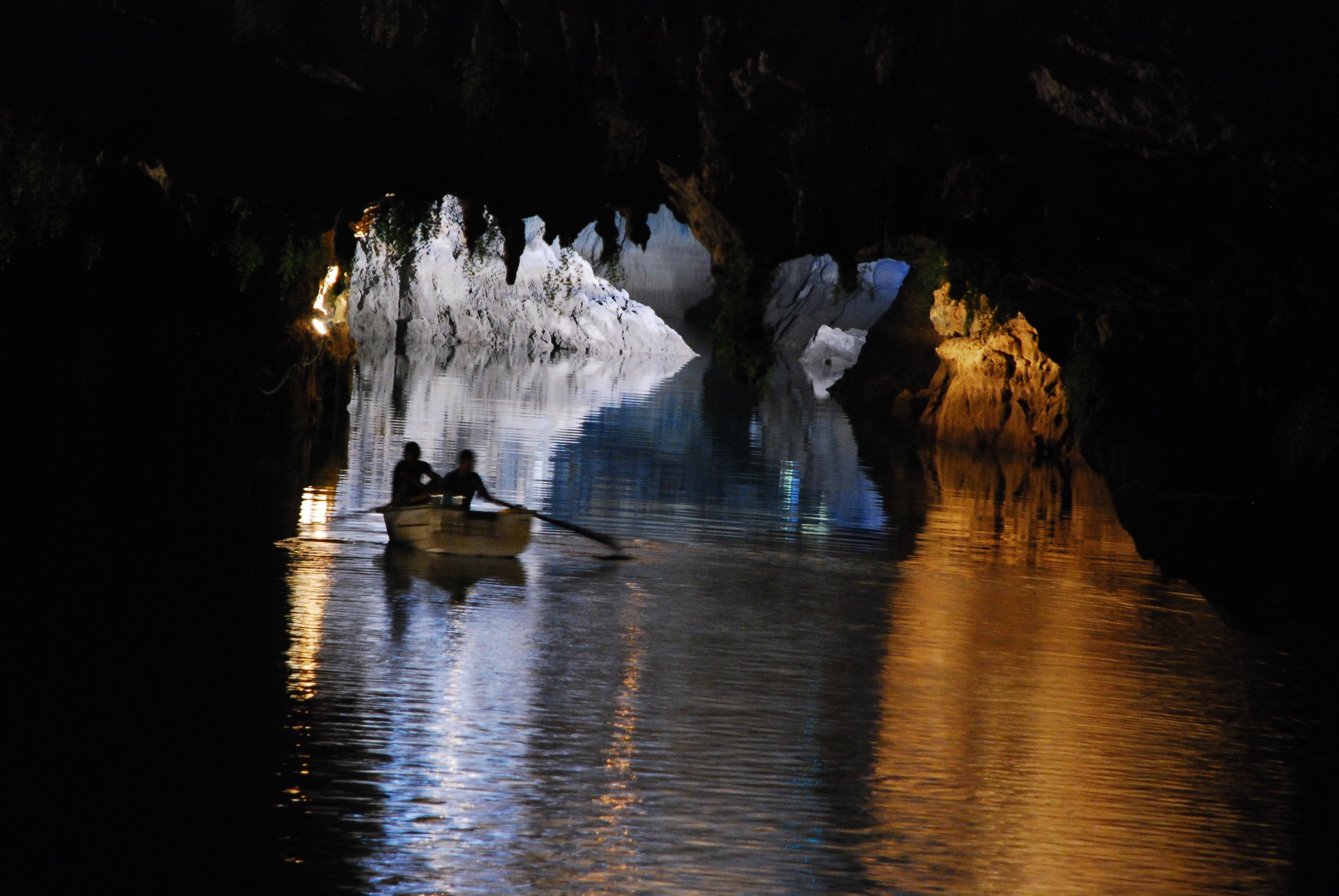 A couple of people row inside Altınbeşik Cave, on its underground lake, Antalya, southern Turkey, March 5, 2021. (IHA Photo)