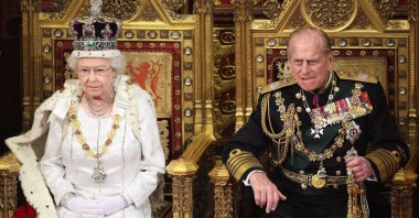 Britain's Queen Elizabeth waits to read the Queen's Speech to lawmakers in the House of Lords, next to Prince Philip, during the State Opening of Parliament in central London May 9, 2012. (Reuters Photo)