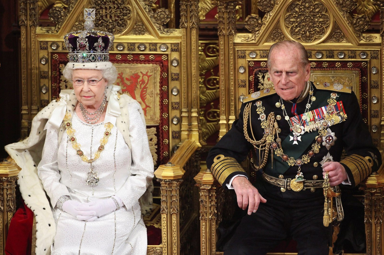 Britain's Queen Elizabeth waits to read the Queen's Speech to lawmakers in the House of Lords, next to Prince Philip, during the State Opening of Parliament in central London May 9, 2012. (Reuters Photo)