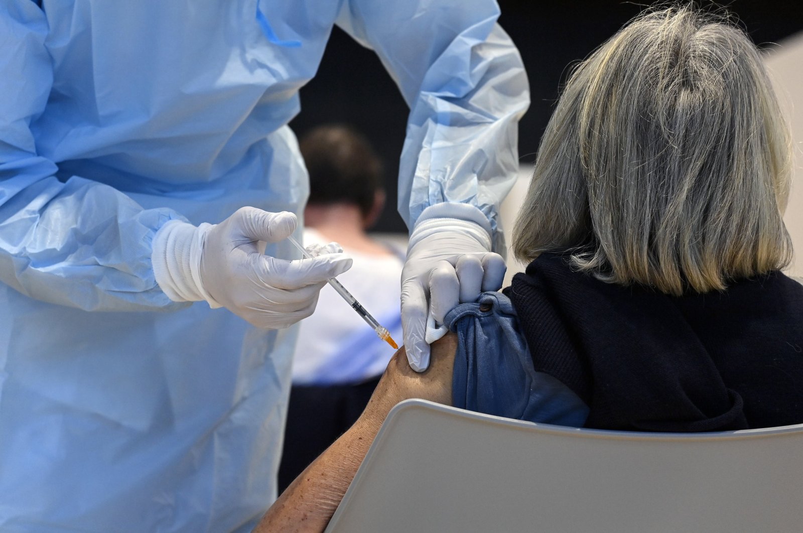 A woman receives a COVID-19 vaccine at the vaccination center set up at the La Nuvola congress center in Rome, Italy, April 4, 2021. (EPA Photo)