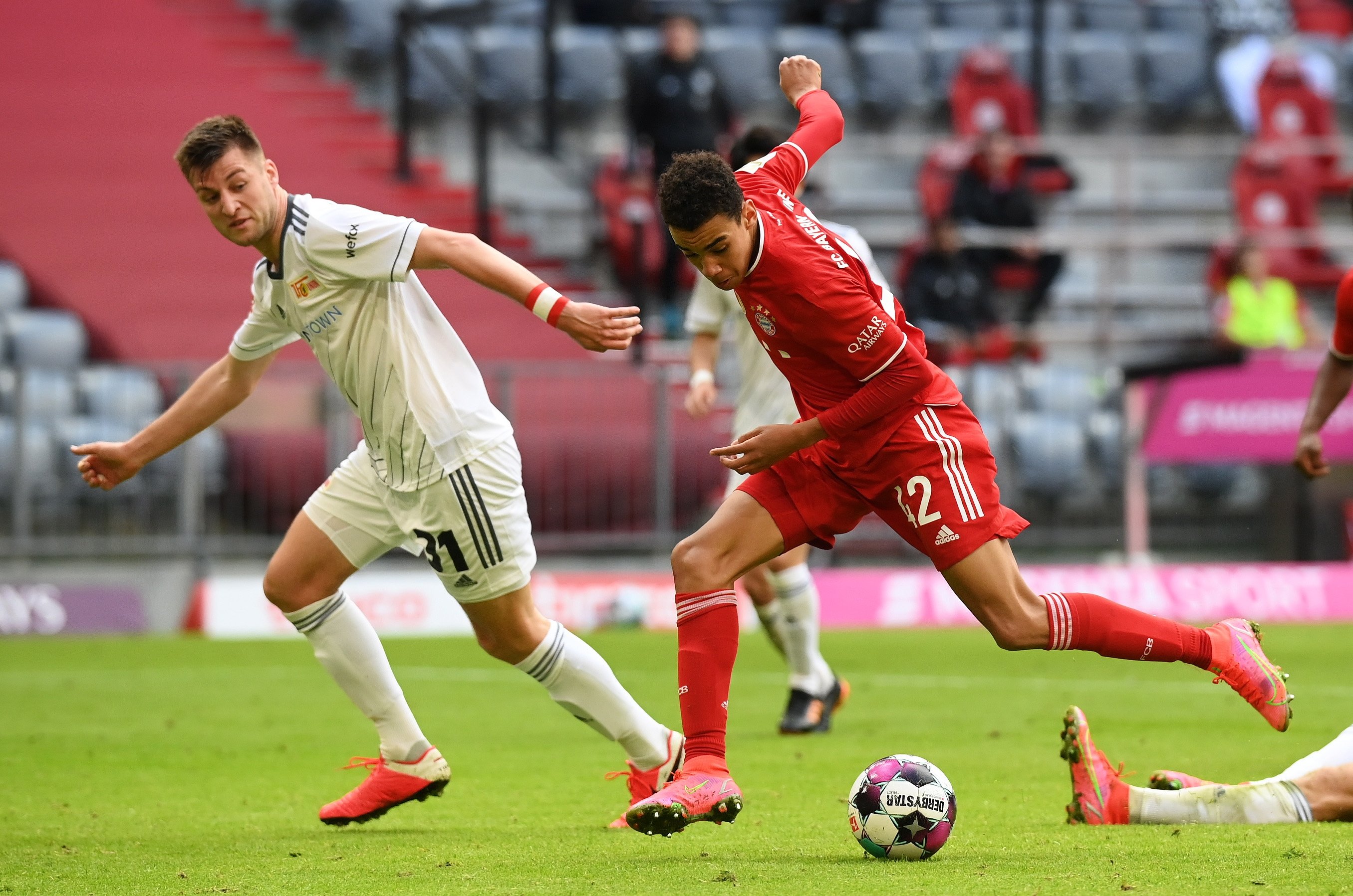 Bayern Munich's Jamal Musiala (R) scores his team's first goal during the Bundesliga soccer match against 1. FC Union Berlin at Allianz Arena in Munich, Germany, April 10, 2021. (Matthias Hangst/DFL/Pool via EPA)