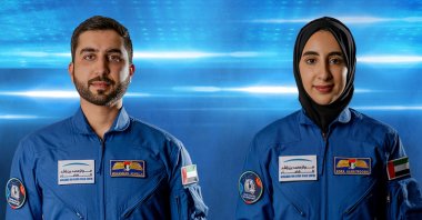 A handout photo made available by Emirates News Agency (WAM) shows Mohammed al-Mulla (L) and Noura al-Matroushi, the newly announced UAE astronauts for the country's space program, United Arab Emirates, April 10, 2021. (Emirates News Agency Photo via epa)