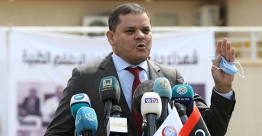 Libyan Prime Minister Abdelhamid Dbeibah delivers a speech outside the Centre for Disease Control in the capital Tripoli, Libya, April 10, 2021. (Mahmud TURKIA / AFP)