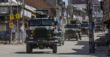 Indian Army vehicles leave after a gun battle in Shopian, south of Srinagar, Indian-controlled Jammu and Kashmir, April 9, 2021. (AFP Photo)