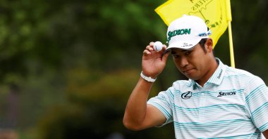 Japan's Hideki Matsuyama acknowledges the crowd after holing his eagle putt on the 15th green during the third round at the Masters, Augusta National Golf Club, Augusta, Georgia, U.S., April 10, 2021. (Reuters Photo)