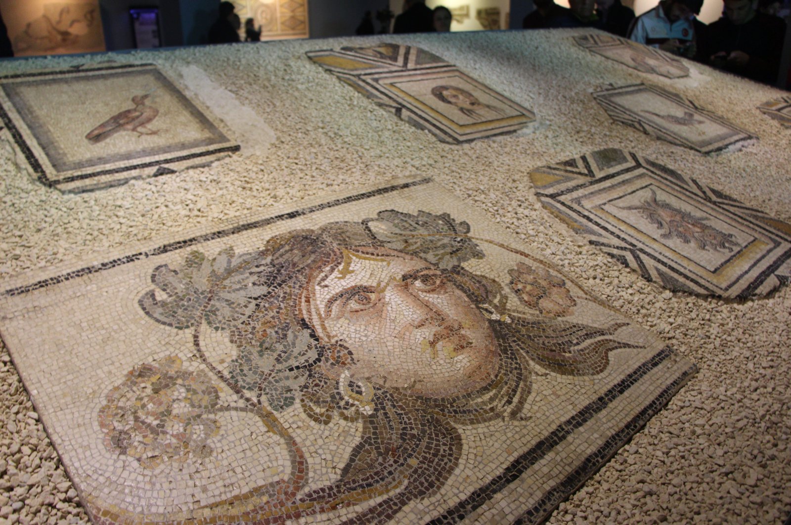 Pieces of "Gypsy Girl," a famed mosaic brought back from the United States in 2018, on display at a museum in Gaziantep, southern Turkey, Sept. 12, 2018. (DHA PHOTO)