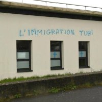 This handout picture released by the French Ministry of Justice shows graffiti tags that read, "Immigration kills," sprayed on the walls of the Avicenna mosque and Islamic cultural center in Rennes, western France, April 11, 2021. (AFP Photo)