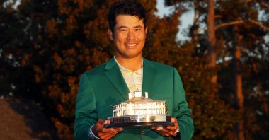 Japan's Hideki Matsuyama poses with the Masters Trophy at Augusta National Golf Club, Augusta, Georgia, April 11, 2021. (AFP Photo)