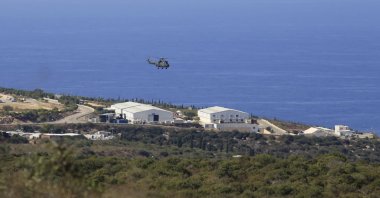 A helicopter flies over a base of the U.N. peacekeeping force, where U.S.-mediated talks were held over a disputed maritime border between Israel and Lebanon, in the southern town of Naqoura, Lebanon, Oct. 14, 2020. (AP Photo)