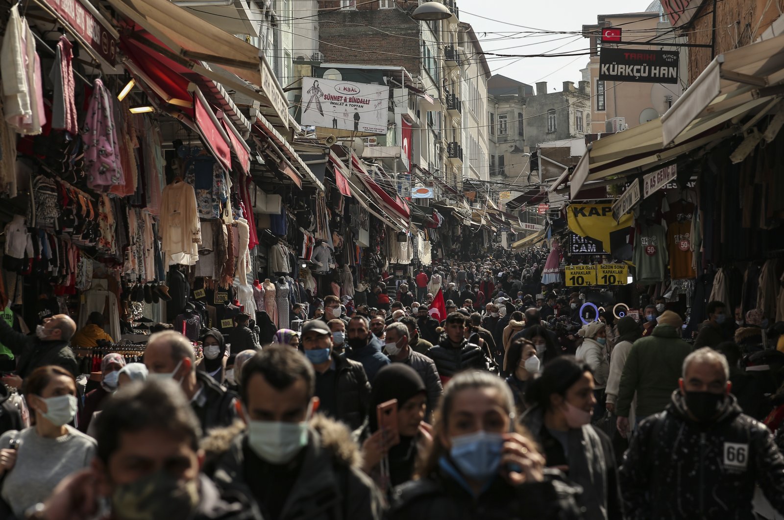 People walk in an open market in Istanbul, Turkey, March 22, 2021. (AP Photo)
