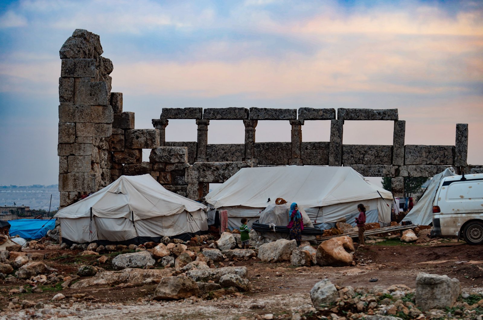 A group of displaced Syrians at their makeshift tents set up at the Dana ancient site, Idlib, northern Syria, Dec. 20, 2020. (Photo by Getty Images)