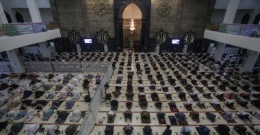 People pray ahead of the holy fasting month of Ramadan, as mosques reopen amid the COVID-19 pandemic in Palangkaraya, Central Kalimantan province, Indonesia, April 12, 2021. (Makna Zaezar/Antara Foto via Reuters)