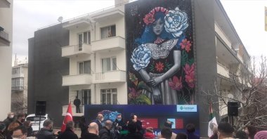 People attend the introduction of "Blossom" by Mexican artist Kathrina Rupit on Güvenlik Street in the Çankaya district of Ankara, Turkey, April 13, 2021. (AA Photo)