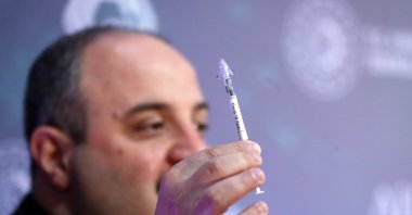 Minister of Industry and Technology Mustafa Varank holds a nasal vaccine during an event in the capital Ankara, Turkey, March 31, 2021. (AA PHOTO)