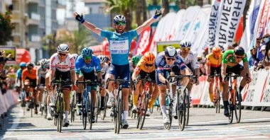 Deceuninck-Quick Step's British sprinter Mark Cavendish celebrates winning the 3rd stage of Presidential Cycling Tour of Turkey, in Alanya, southern Turkey, April 13, 2021. (DHA Photo)