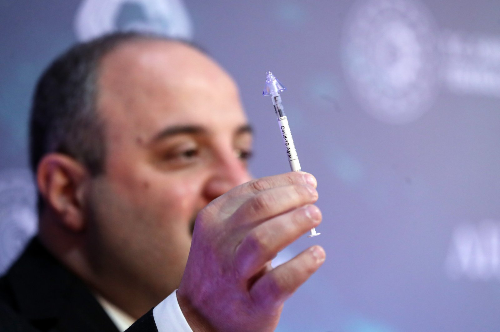 Minister of Industry and Technology Mustafa Varank holds a nasal vaccine during an event in the capital Ankara, Turkey, March 31, 2021. (AA PHOTO)