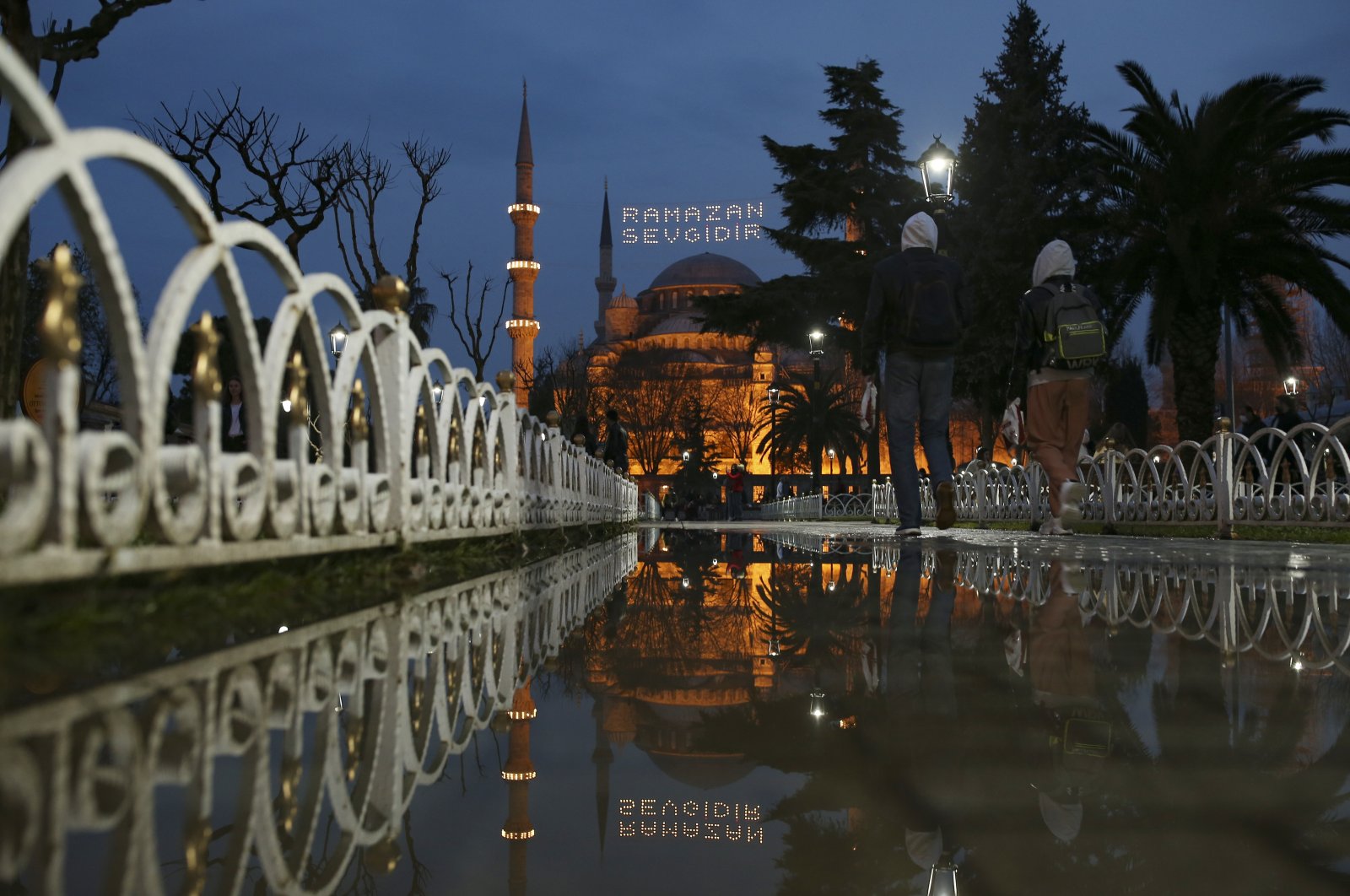 The iconic Sultan Ahmet Mosque, better known as the Blue Mosque, decorated with lights and a slogan reading “Ramadan is love,” in the historic Sultan Ahmet district of Istanbul, Turkey, Tuesday, April 13, 2021. (AP Photo)