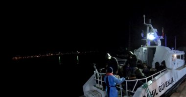 The Turkish coast guard rescues 34 migrants and refugees pushed back by Greece off the coast of Muğla province, April 14, 2021. (IHA Photo)