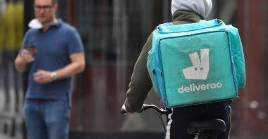 A Deliveroo delivery rider cycles in London, Britain, March 31, 2021. (REUTERS Photo)