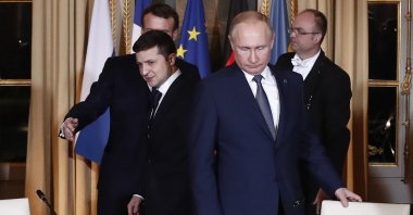 Russian President Vladimir Putin (R) and Ukrainian President Volodymyr Zelenskiy arrive for a working session at the Elysee Palace, Paris, France, Dec. 9, 2019. (AP Photo)