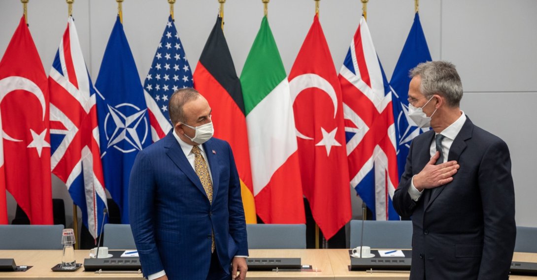 Foreign Minister Mevlüt Çavuşoğlu (R) and NATO chief Jens Stoltenberg greet each other on the sidelines of a NATO Council meeting on Afghanistan in Brussels, Belgium, Apr. 14, 2021. (AA Photo)