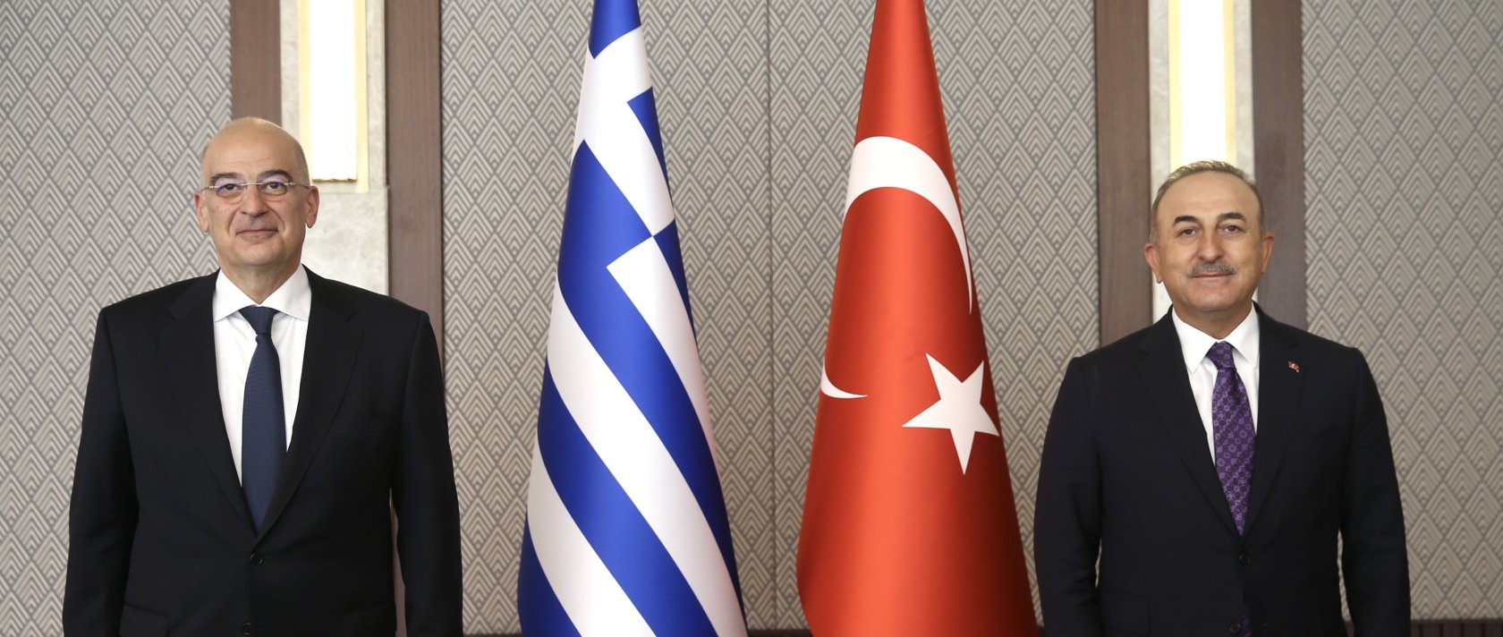 Greek Foreign Minister Nikos Dendias (L) and Turkish Foreign Minister Mevlüt Çavuşoğlu pose for a photo prior to their meeting in Ankara, Turkey, April 15, 2021. (Photo made available by the Turkish Foreign Ministry's press office/EPA Photo)