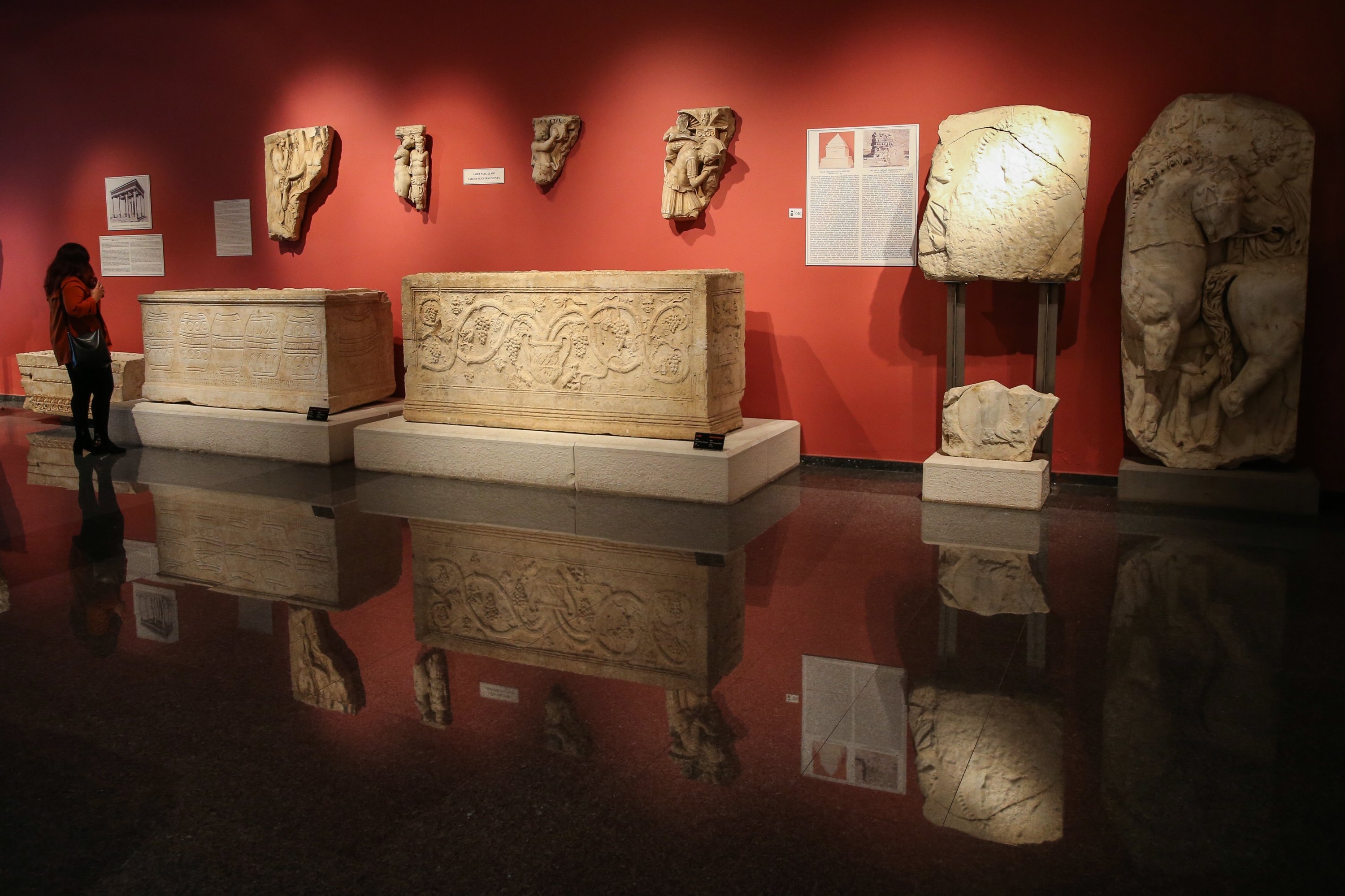 A visitor examines some sarcophagi in the Antalya Museum, Antalya, southern Turkey, April 16, 2021. (AA Photo)