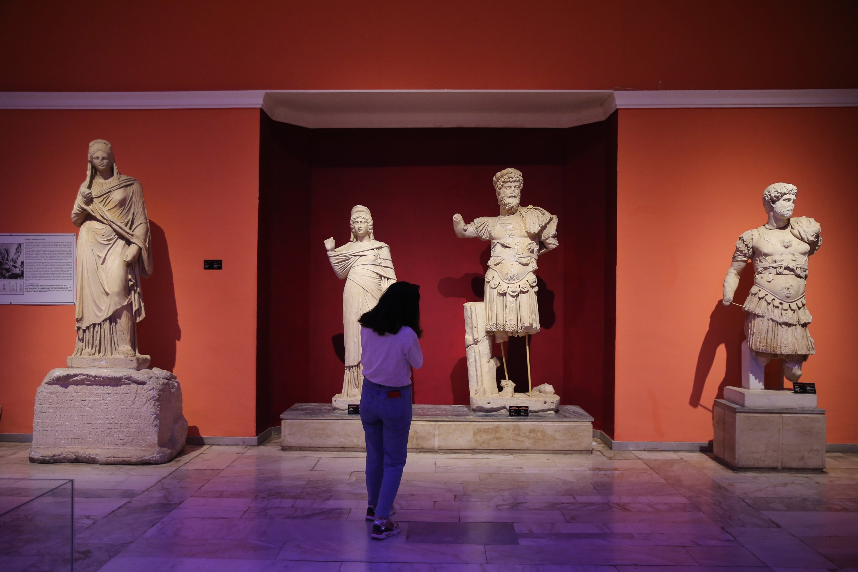 A visitor examines sculptures in the Antalya Museum, Antalya, southern Turkey, April 16, 2021. (AA Photo)