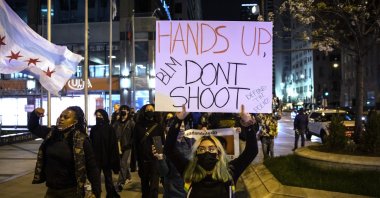 Protesters march down the Magnificent Mile after the city of Chicago released the videos of 13-year-old Adam Toledo being fatally shot by a Chicago police officer, in Chicago, U.S, April 15, 202. (AP Photo)