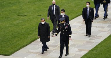 Japanese Prime Minister Yoshihide Suga at the Tomb of the Unknown Soldier for a wreath laying ceremony with U.S. Army Maj. Gen. Omar Jones at Arlington National Cemetery in Arlington, Virginia, U.S., April 16, 2021. (AP Photo)