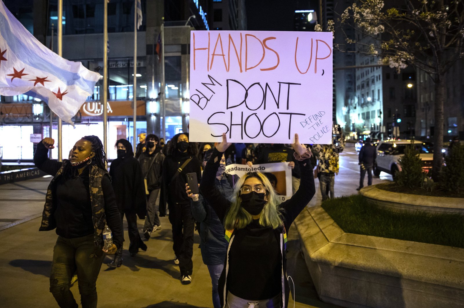 Protesters march down the Magnificent Mile after the city of Chicago released the videos of 13-year-old Adam Toledo being fatally shot by a Chicago police officer, in Chicago, U.S, April 15, 202. (AP Photo)