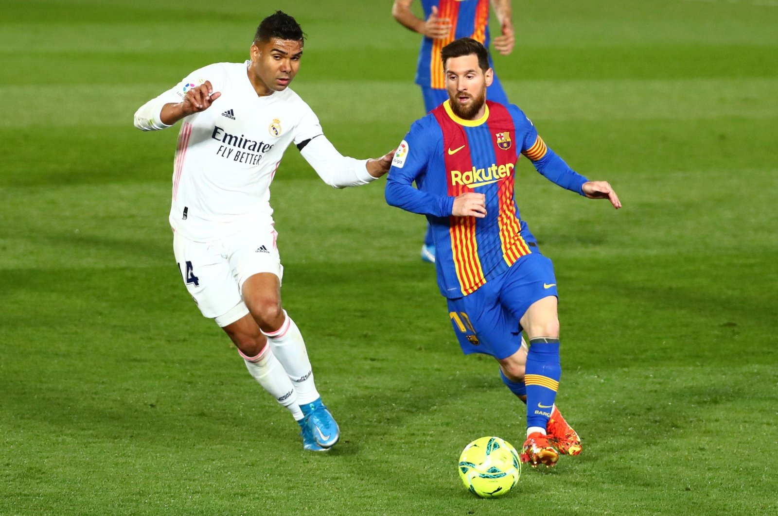 Real Madrid's Casemiro in action with Barcelona's Lionel Messi in a La Liga match Estadio Alfredo Di Stefano, Madrid, Spain, April 10, 2021. (Reuters Photo)