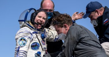 The International Space Station (ISS) crew member Kathleen Rubins of NASA reacts shortly after the landing of the Soyuz MS-17 space capsule in a remote area outside Zhezkazgan, Kazakhstan, April 17, 2021. (NASA/Bill Ingalls/via Reuters)