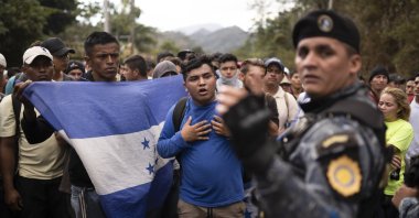 Honduran migrants hoping to reach the U.S. border are stopped at the Honduras border by Guatemalan police near Agua Caliente, Guatemala, Jan. 16, 2020. (AP Photo)