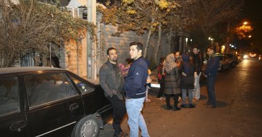 People stand outside their houses in Tehran after a late-night magnitude 5.2 earthquake jolted a town near Iran's capital, Dec. 21, 2017. (AP Photo)