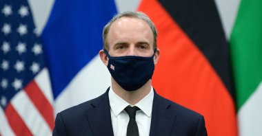 Britain's Foreign Secretary Dominic Raab wears a protective mask as he poses for a picture during a meeting at NATO's headquarters in Brussels, Belgium, April 14, 2021. (AFP Photo)