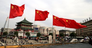 Chinese national flags flutter on the street on the fourth day of the National Day and Mid-Autumn Festival holiday, in Xi'an, Shaanxi, China, Oct. 4, 2020. (Photo by Getty Images)