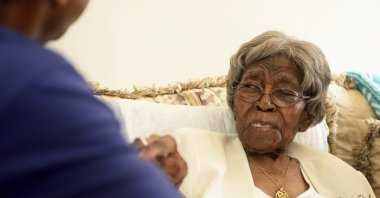 Roosevelt Patterson greets his grandmother Hester "Granny" Ford during Ford's 111th birthday party, North Carolina, U.S., Aug. 13, 2016. (AP Photo)