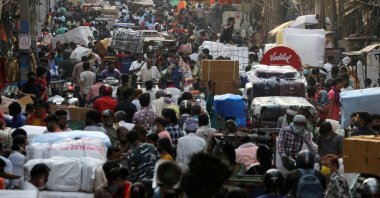 People walk at a crowded market amidst the spread of COVID-19, in the old quarters of Delhi, India, April 6, 2021. (Reuters Photo)