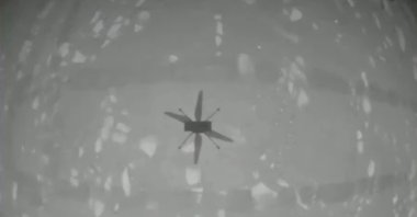 The shadow of NASA's Mars helicopter Ingenuity is seen during its first flight on the planet in this still image taken from a video on April 19, 2021. (NASA/JPL-Caltech/ASU/Handout via Reuters)