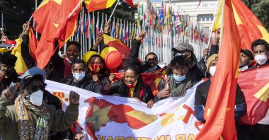 Members of the Ethiopian Tigray community in Switzerland protest against the Ethiopian government for what they call a civil war in Tigray and genocide on Tigray people on the "Place des Nations" in front of the European headquarters of the United Nations, in Geneva, Switzerland, April 16, 2021. (Keystone via AP)
