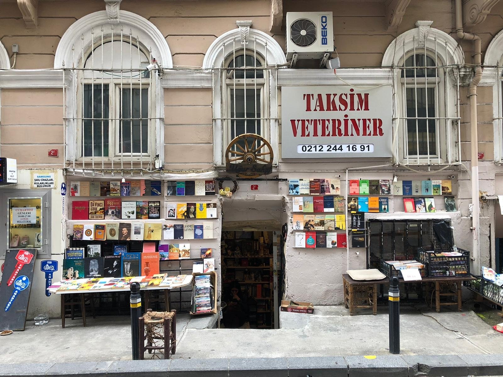 Uğur Sahaf sits across from a cafe, next to a veterinarian, on a side street in Cihangir, Istanbul, Turkey. (Photo by Matt Hanson)