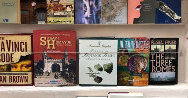 Uğur Sahaf's books are on show, loud and proud, held taut by wires that pin them against the walls of the store, Istanbul, Turkey. (Photo by Matt Hanson)