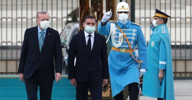 President Recep Tayyip Erdoğan (L) and Libyan Prime Minister Abdul Hamid Dbeibah walk past a guard of honor during the official ceremony prior to their meeting in Ankara, Turkey,  April 12, 2021. (AFP Photo)