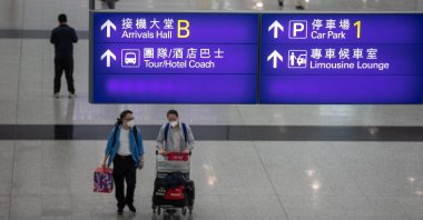 Passengers walk in the arrival hall at Hong Kong International Airport in Hong Kong, China, April 20, 2021. (EPA Photo)
