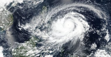 A satellite image released NASA shows typhoon Surigae approaching Philippines, April, 17, 2021. (AP Photo)