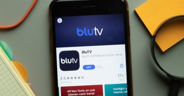 BluTV mobile app logo seen on a phone screen, New York, the U.S., Oct. 26, 2020. (Shutterstock Photo)